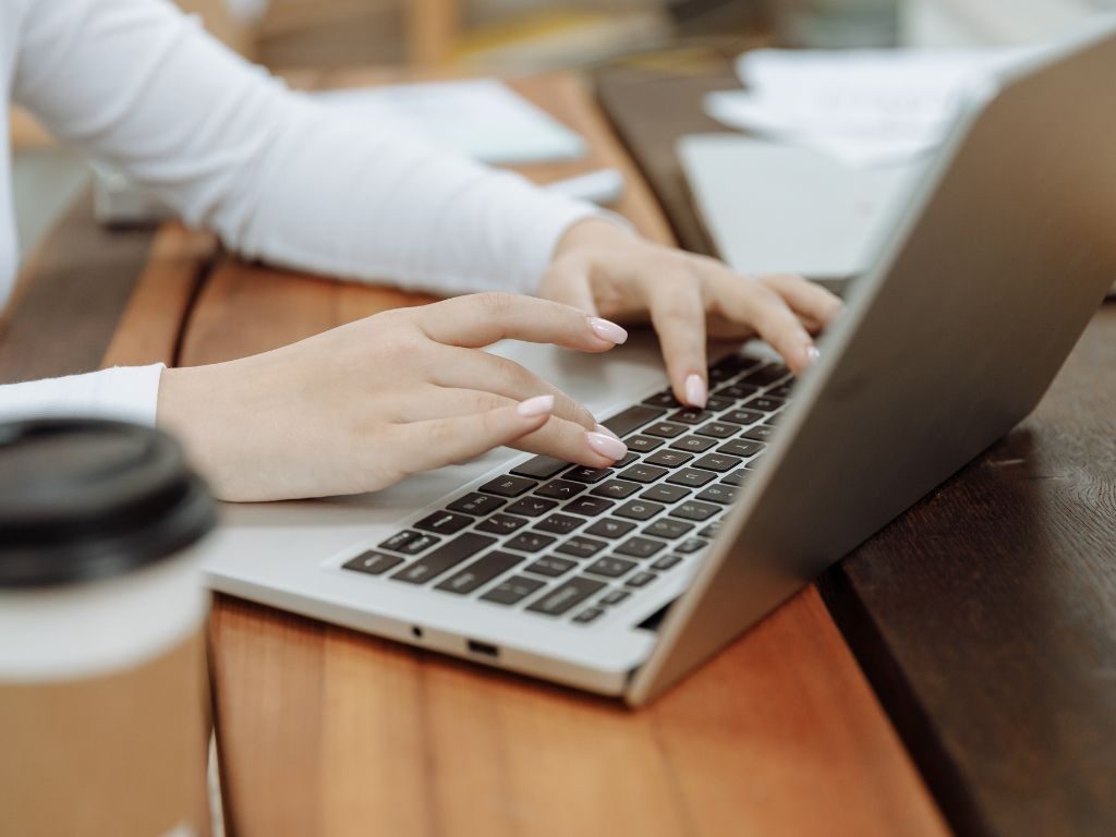 Entering blood bank records on a laptop