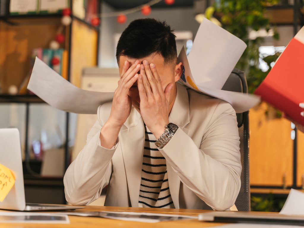 Staff member overwhelmed by paperwork